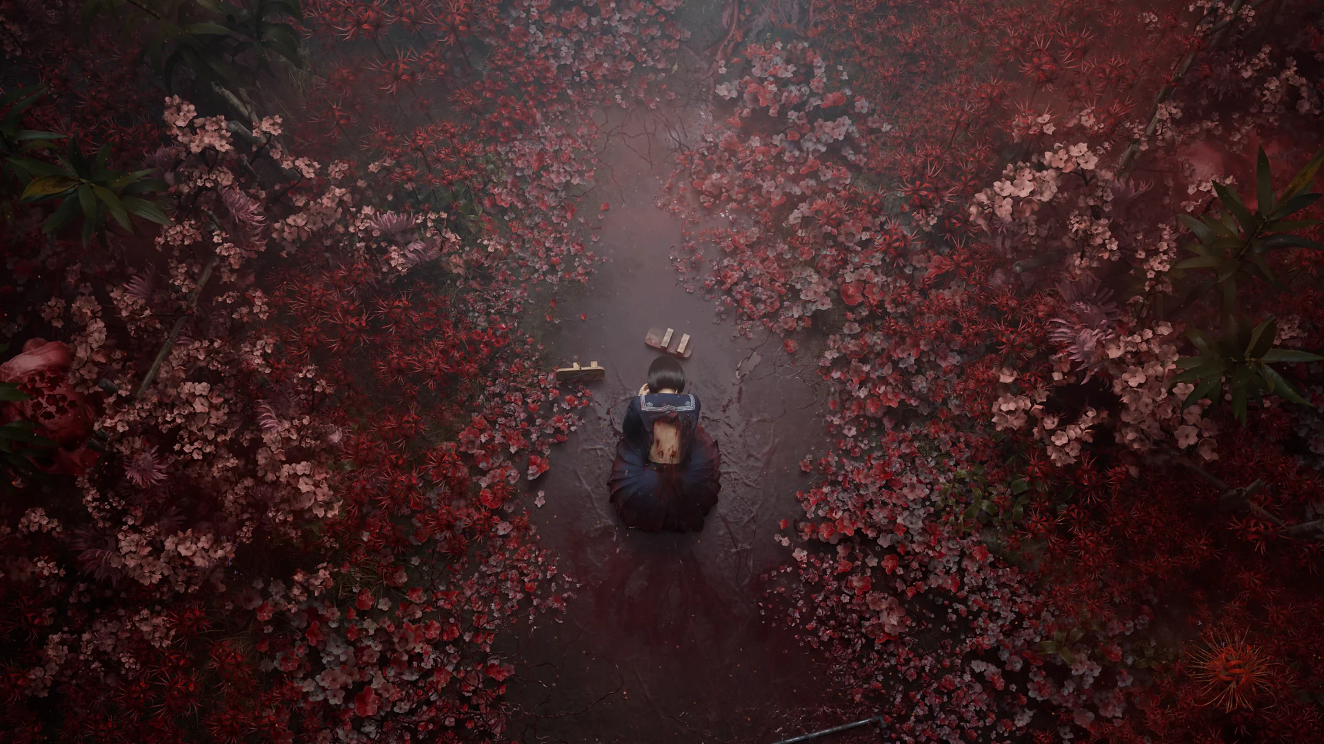 An overhead shot from Silent Hill f shows Hinako Shimizu, the protagonist, kneeling or crouching on a dark, narrow path. The path is surrounded by an overwhelmingly dense and vibrant array of red and pink foliage, creating a stark contrast against the dark ground. The foliage appears to be an unearthly, overgrown variety, contributing to the eerie and unsettling atmosphere of the scene.