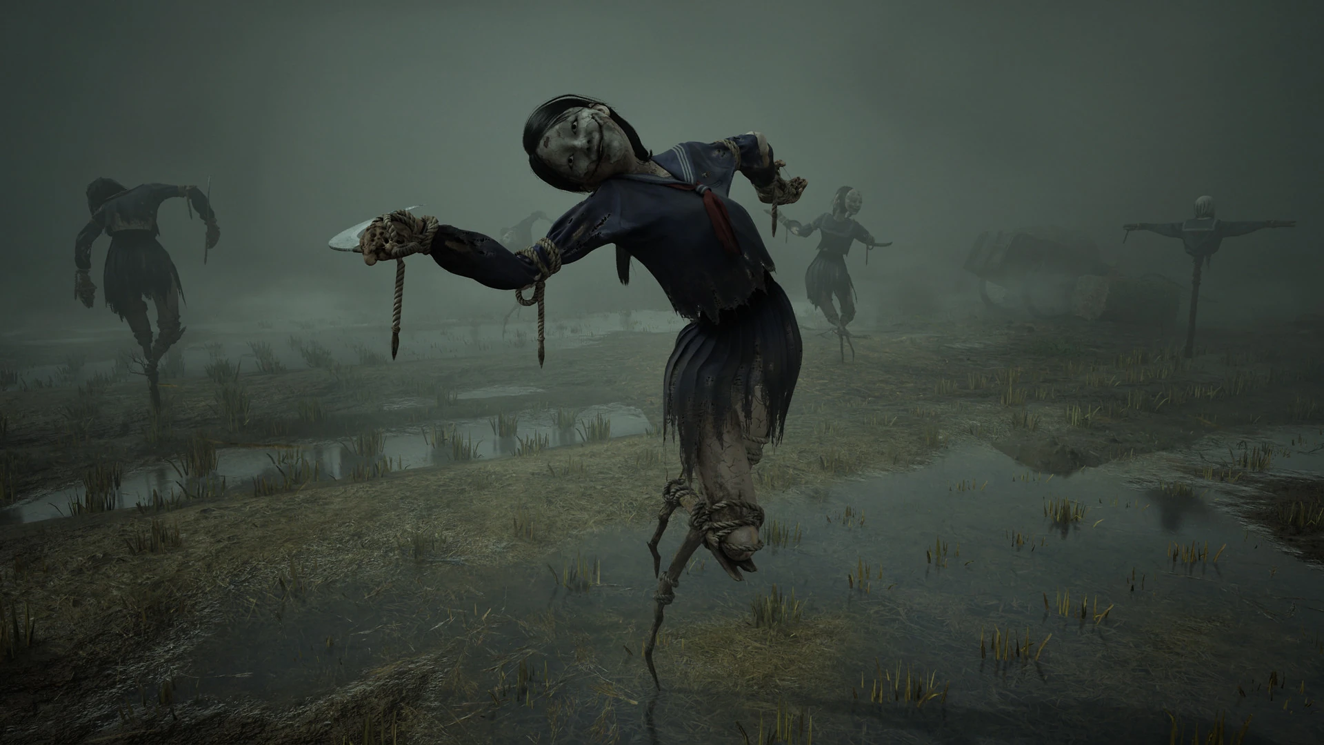An unsettling scene from Silent Hill f depicts three Ayakakashi in a misty, waterlogged environment. The central figure, dressed in a dark school uniform, is the most prominent, its face disfigured and its limbs appearing to be bound with rope. The other two Ayakakashi are further back in the fog, less distinct but similarly eerie. The ground is covered in shallow water and sparse vegetation, adding to the desolate and foreboding atmosphere.