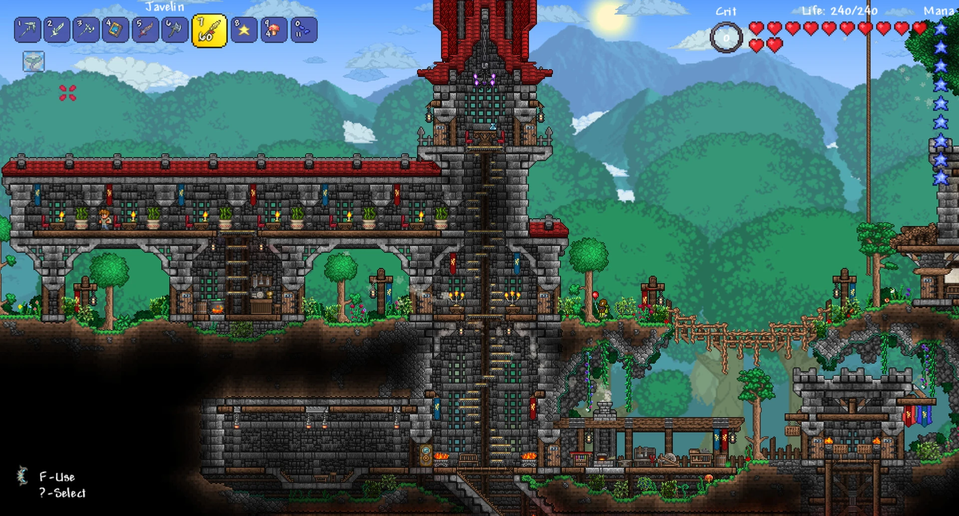 A detailed screenshot from a modded Terraria showing a large, multi-story stone castle base with a red roof, built into a lush green landscape.